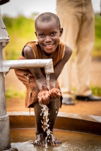 Uganda - Girl at well