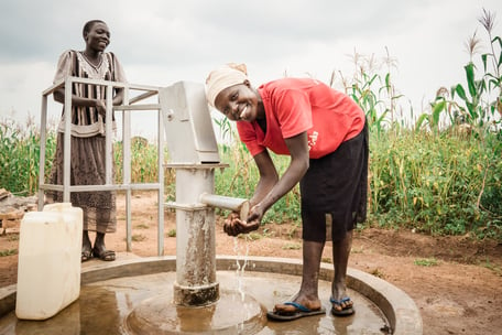 Uganda - Woman at well